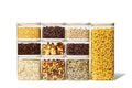 Naked Kitchen 20-piece glass countertop set with cream lids holding pantry staples including pasta, grains, nuts and coffee