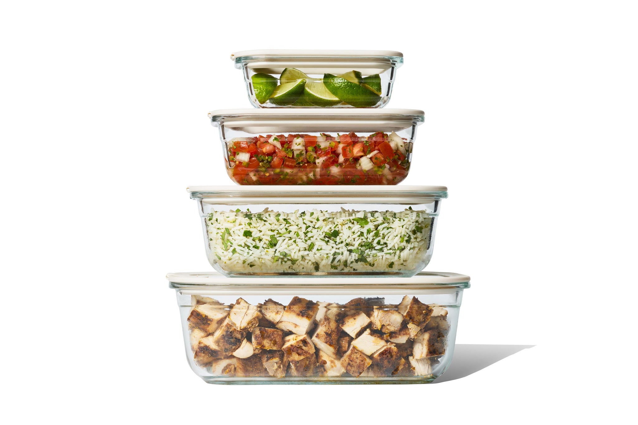 Set of Naked Kitchen glass food storage containers with lids on a white background