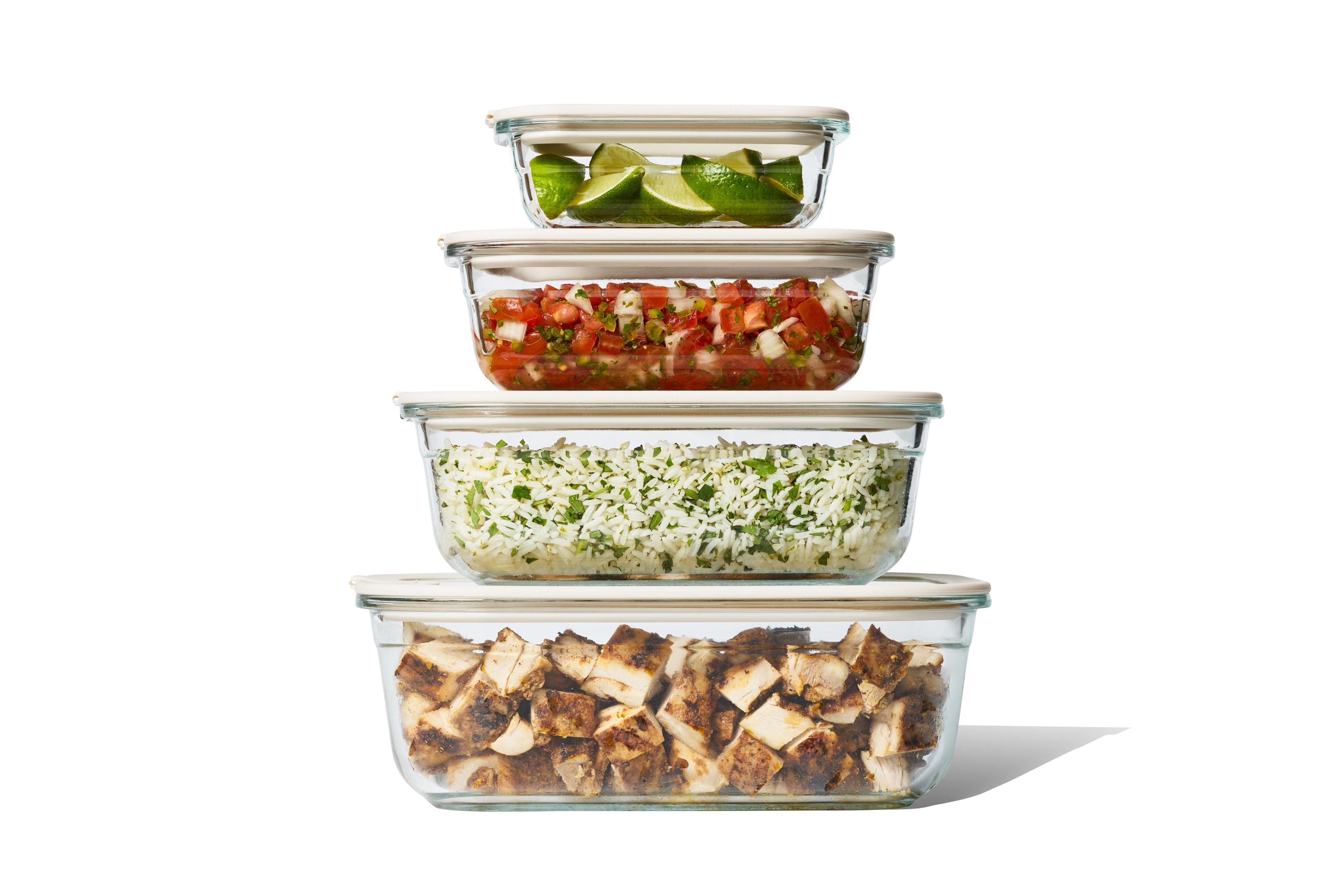 Set of Naked Kitchen glass food storage containers with lids on a white background