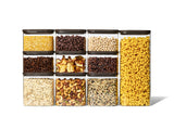 Full Naked Kitchen 20-piece glass countertop set with black lids holding pantry staples including pasta, grains, nuts and coffee