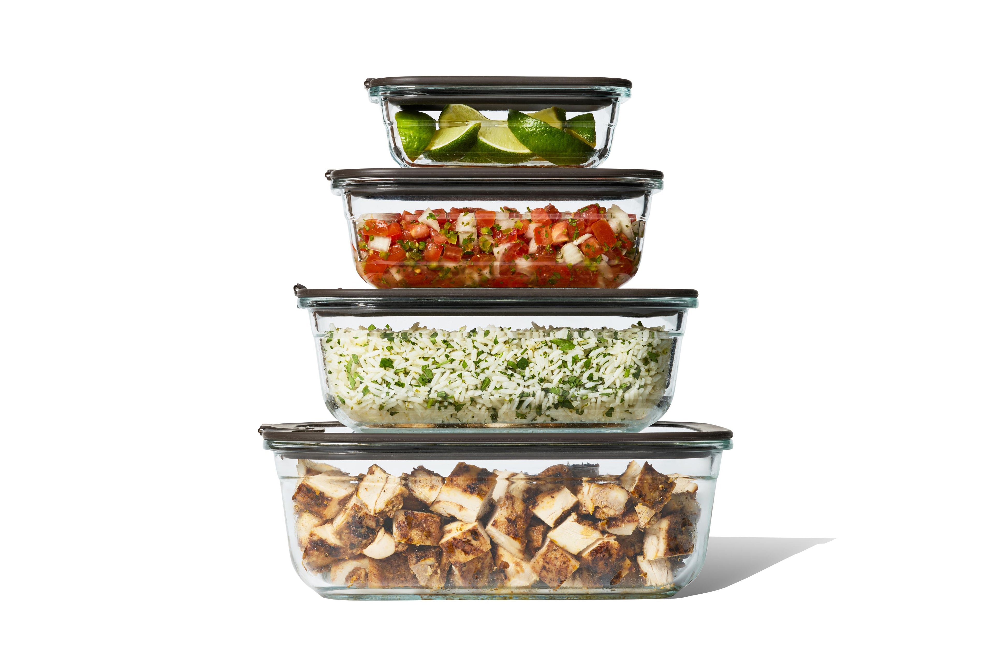 Set of Naked Kitchen glass food storage containers with lids on a white background