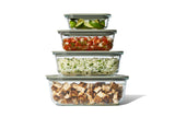 Set of Naked Kitchen glass food storage containers with lids on a white background