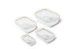 Set of Naked Kitchen glass food storage containers with lids on a white background