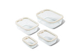 Set of Naked Kitchen glass food storage containers with lids on a white background
