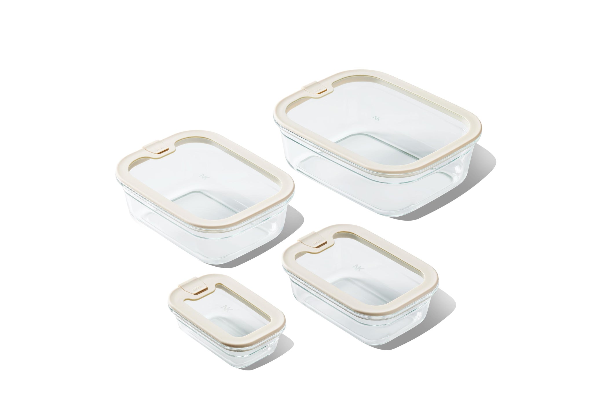 Set of Naked Kitchen glass food storage containers with lids on a white background