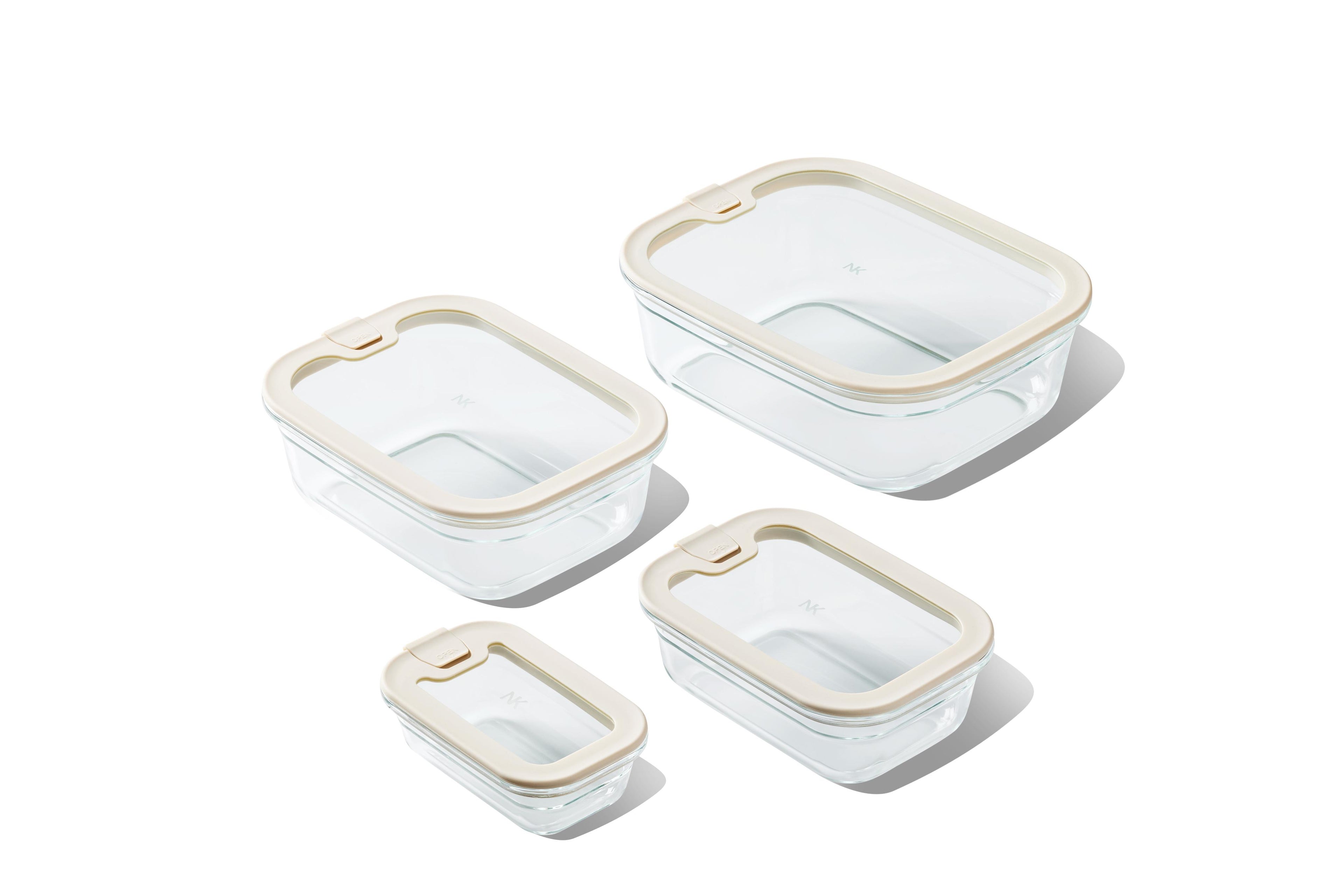 Set of Naked Kitchen glass food storage containers with lids on a white background