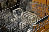 Dishwasher-safe Naked Kitchen glass containers and lids arranged in a dishwasher rack